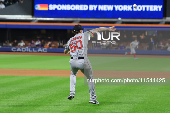 Boston Red Sox pitcher Kutter Crawford #50 fields the ball and throws to first base during the fourth inning of the baseball game against th...