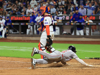 Boston Red Sox Jarren Duran #16 scores on a sacrifice fly during the sixth inning of the baseball game against the New York Mets at Citi Fie...