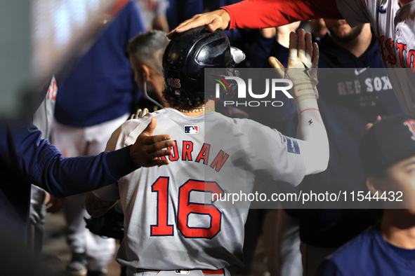 Boston Red Sox Jarren Duran #16 is congratulated after scoring on a sacrifice fly during the sixth inning of the baseball game against the N...