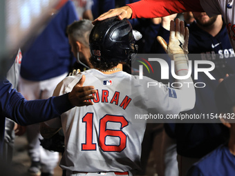 Boston Red Sox Jarren Duran #16 is congratulated after scoring on a sacrifice fly during the sixth inning of the baseball game against the N...