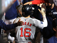 Boston Red Sox Jarren Duran #16 is congratulated after scoring on a sacrifice fly during the sixth inning of the baseball game against the N...