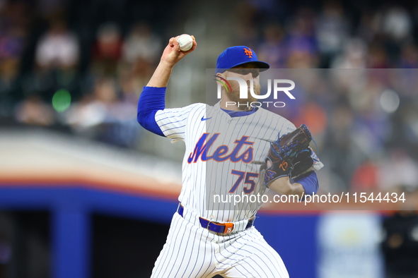 New York Mets relief pitcher Reed Garrett #75 throws during the eighth inning of the baseball game against the Boston Red Sox at Citi Field...