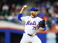 New York Mets relief pitcher Reed Garrett #75 throws during the eighth inning of the baseball game against the Boston Red Sox at Citi Field...