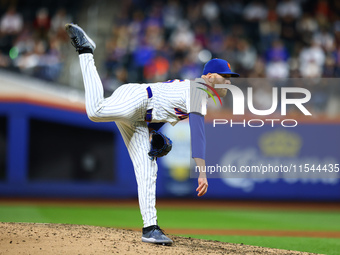 New York Mets relief pitcher Reed Garrett #75 throws during the eighth inning of the baseball game against the Boston Red Sox at Citi Field...