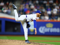 New York Mets relief pitcher Reed Garrett #75 throws during the eighth inning of the baseball game against the Boston Red Sox at Citi Field...