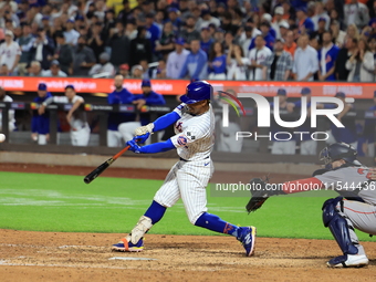 Francisco Lindor #12 of the New York Mets doubles during the eighth inning of the baseball game against the Boston Red Sox at Citi Field in...