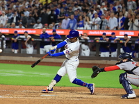 Francisco Lindor #12 of the New York Mets doubles during the eighth inning of the baseball game against the Boston Red Sox at Citi Field in...