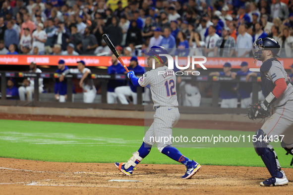 Francisco Lindor #12 of the New York Mets doubles during the eighth inning of the baseball game against the Boston Red Sox at Citi Field in...