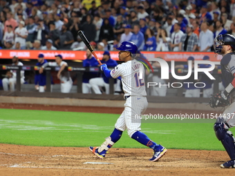 Francisco Lindor #12 of the New York Mets doubles during the eighth inning of the baseball game against the Boston Red Sox at Citi Field in...