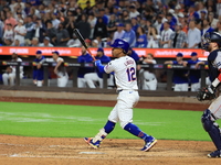 Francisco Lindor #12 of the New York Mets doubles during the eighth inning of the baseball game against the Boston Red Sox at Citi Field in...