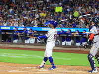 Francisco Lindor #12 of the New York Mets hits a home run during the third inning of the baseball game against the Boston Red Sox at Citi Fi...