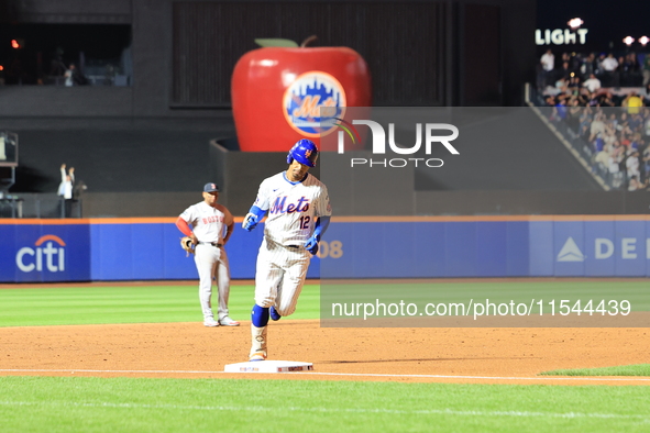 Francisco Lindor #12 of the New York Mets hits a home run during the third inning of the baseball game against the Boston Red Sox at Citi Fi...