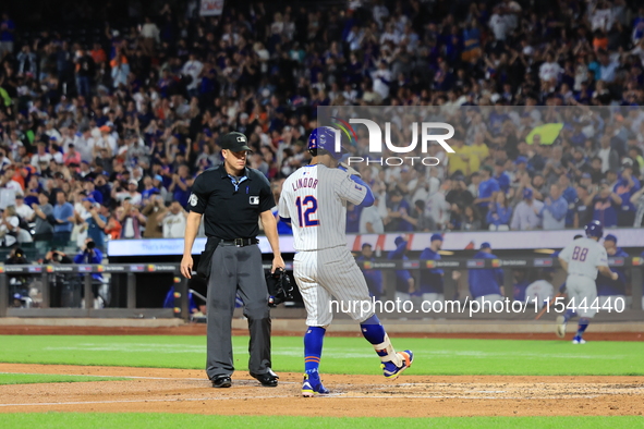 Francisco Lindor #12 of the New York Mets hits a home run during the third inning of the baseball game against the Boston Red Sox at Citi Fi...