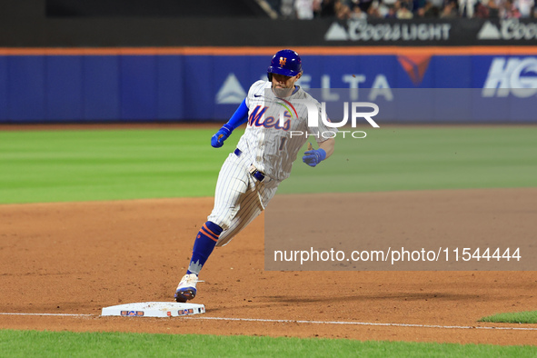 Jeff McNeil #1 of the New York Mets scores from second base during the eighth inning of the baseball game against the Boston Red Sox at Citi...