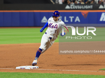 Jeff McNeil #1 of the New York Mets scores from second base during the eighth inning of the baseball game against the Boston Red Sox at Citi...