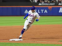 Jeff McNeil #1 of the New York Mets scores from second base during the eighth inning of the baseball game against the Boston Red Sox at Citi...