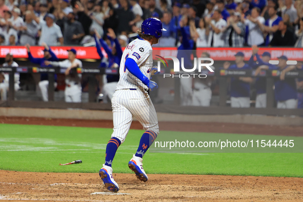 Jeff McNeil #1 of the New York Mets scores from second base during the eighth inning of the baseball game against the Boston Red Sox at Citi...