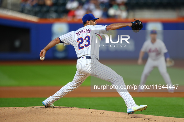 New York Mets starting pitcher David Peterson #23 throws during the first inning of the baseball game against the Boston Red Sox at Citi Fie...