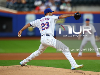 New York Mets starting pitcher David Peterson #23 throws during the first inning of the baseball game against the Boston Red Sox at Citi Fie...