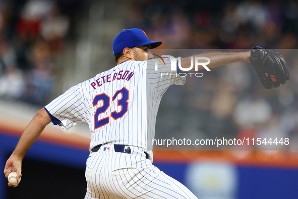 New York Mets starting pitcher David Peterson #23 throws during the second inning of the baseball game against the Boston Red Sox at Citi Fi...