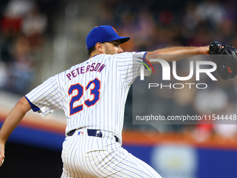 New York Mets starting pitcher David Peterson #23 throws during the second inning of the baseball game against the Boston Red Sox at Citi Fi...