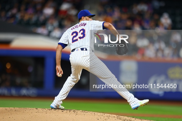 New York Mets starting pitcher David Peterson #23 throws during the second inning of the baseball game against the Boston Red Sox at Citi Fi...