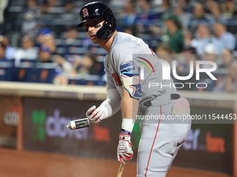 Nick Sogard #75 of the Boston Red Sox tosses a can containing a sticky substance during the third inning of the baseball game against the Ne...