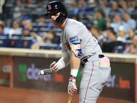 Nick Sogard #75 of the Boston Red Sox tosses a can containing a sticky substance during the third inning of the baseball game against the Ne...