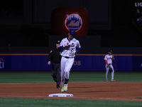 Mark Vientos #27 of the New York Mets rounds the bases after homering during the seventh inning of the baseball game against the Boston Red...