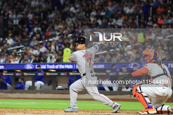 Masataka Yoshida #7 of the Boston Red Sox singles during the fifth inning of the baseball game against the New York Mets at Citi Field in Co...