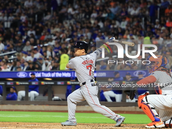 Masataka Yoshida #7 of the Boston Red Sox singles during the fifth inning of the baseball game against the New York Mets at Citi Field in Co...