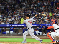 Masataka Yoshida #7 of the Boston Red Sox singles during the fifth inning of the baseball game against the New York Mets at Citi Field in Co...