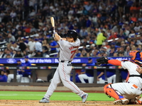 Masataka Yoshida #7 of the Boston Red Sox singles during the fifth inning of the baseball game against the New York Mets at Citi Field in Co...