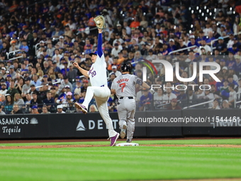 Masataka Yoshida #7 of the Boston Red Sox singles during the fifth inning of the baseball game against the New York Mets at Citi Field in Co...