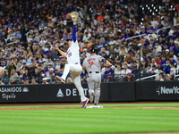 Masataka Yoshida #7 of the Boston Red Sox singles during the fifth inning of the baseball game against the New York Mets at Citi Field in Co...