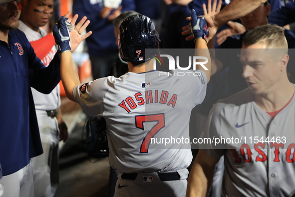 Boston Red Sox Masataka Yoshida #7 scores during the fifth inning of the baseball game against the New York Mets at Citi Field in Corona, N....