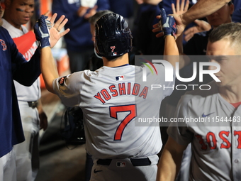 Boston Red Sox Masataka Yoshida #7 scores during the fifth inning of the baseball game against the New York Mets at Citi Field in Corona, N....