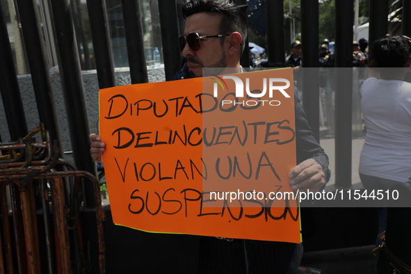 Law students from different universities join a demonstration outside the Sala de Armas in the Ciudad Deportiva in Mexico City, Mexico, to p...