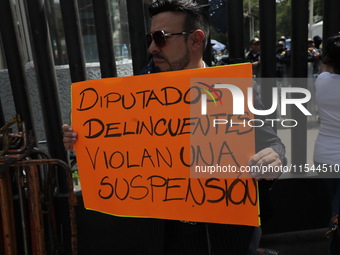 Law students from different universities join a demonstration outside the Sala de Armas in the Ciudad Deportiva in Mexico City, Mexico, to p...