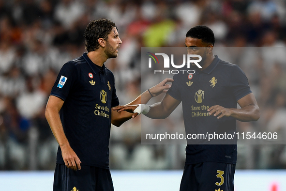 Manuel Locatelli of Juventus talks with Bremer of Juventus during the Serie A match between Juventus FC and AS Roma at Allianz Stadium in Tu...