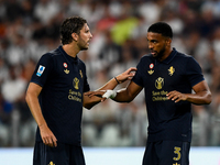 Manuel Locatelli of Juventus talks with Bremer of Juventus during the Serie A match between Juventus FC and AS Roma at Allianz Stadium in Tu...