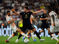 Bryan Cristante of AS Roma fights with Dusan Vlahovic of Juventus during the Serie A match between Juventus FC and AS Roma at Allianz Stadiu...