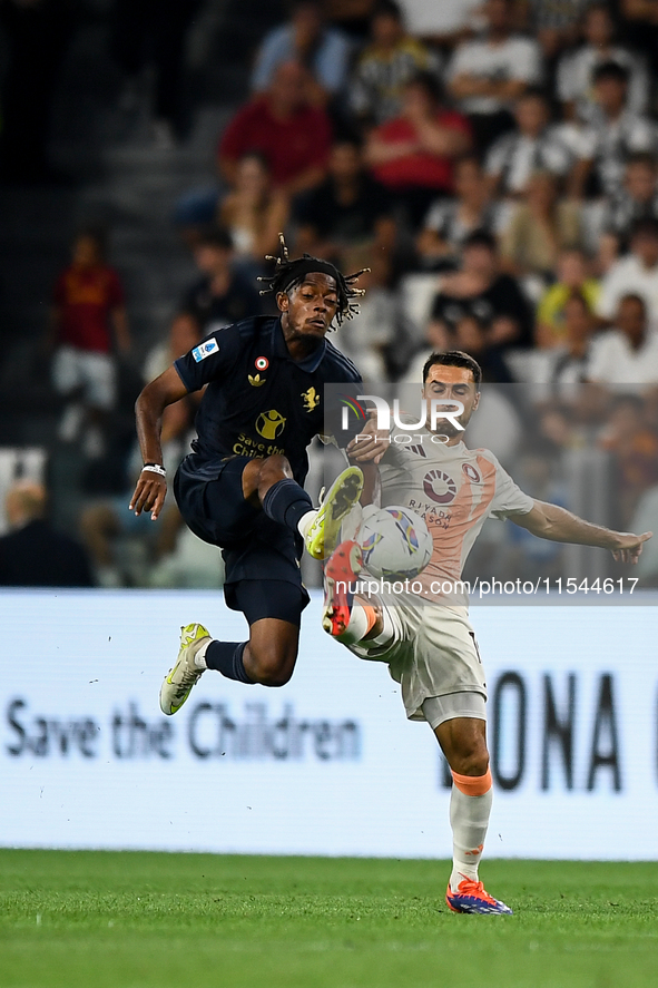 Samuel Mbangula of Juventus fights for the ball with Zeki Celik of AS Roma during the Serie A match between Juventus FC and AS Roma at Allia...