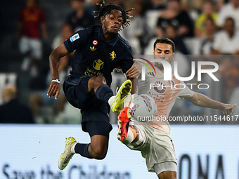 Samuel Mbangula of Juventus fights for the ball with Zeki Celik of AS Roma during the Serie A match between Juventus FC and AS Roma at Allia...