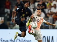 Samuel Mbangula of Juventus fights for the ball with Zeki Celik of AS Roma during the Serie A match between Juventus FC and AS Roma at Allia...