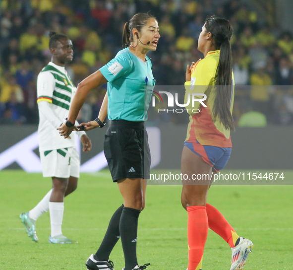 The referee talks with Maithe Lopez of Colombia during the FIFA U-20 Women's World Cup 2024 match between Colombia and Cameroon at the El Ca...