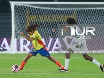 Gabriela Rodriguez of Colombia and Naomi Eto of Cameroon fight for the ball during the FIFA U-20 Women's World Cup 2024 match between Colomb...