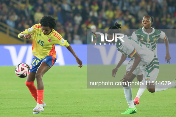 Karla Torres of Colombia and Ngaseh Mbele Berdatte of Cameroon fight for the ball during the FIFA U-20 Women's World Cup 2024 match between...