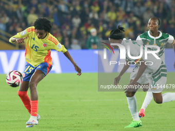 Karla Torres of Colombia and Ngaseh Mbele Berdatte of Cameroon fight for the ball during the FIFA U-20 Women's World Cup 2024 match between...