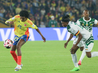 Karla Torres of Colombia and Ngaseh Mbele Berdatte of Cameroon fight for the ball during the FIFA U-20 Women's World Cup 2024 match between...